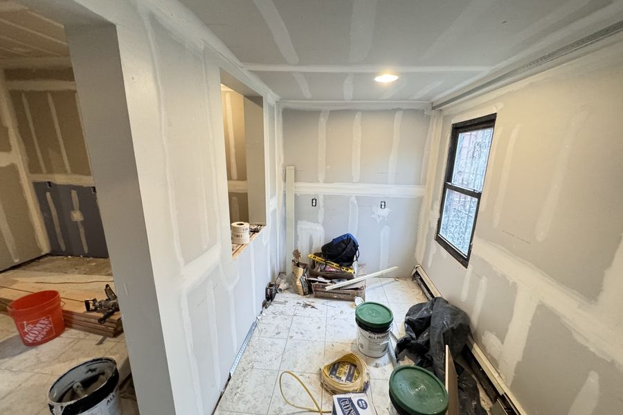 Interior room with new drywall installed and seams ready for finishing