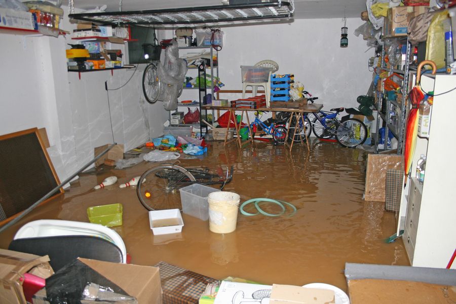 Flooded basement with water covering the floor before cleanup begins